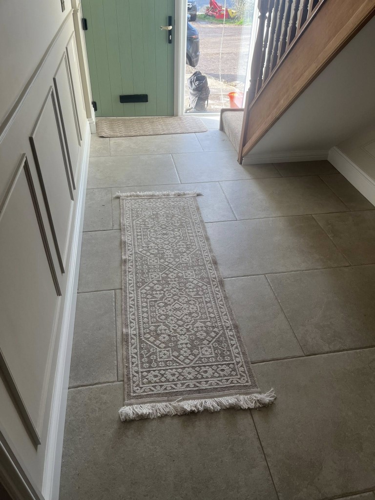 Limestone-effect hallway floor running to the front door